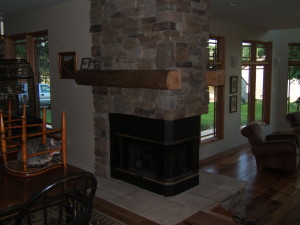 3 sided fireplace of cultured stone