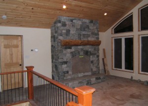 The fireplace with granite stone veneer from a different angle