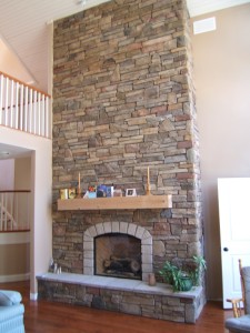 A stunning cultured stone veneer fireplace built with no special floor reinforcement