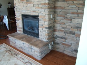 Stone veneer on fireplace and wall