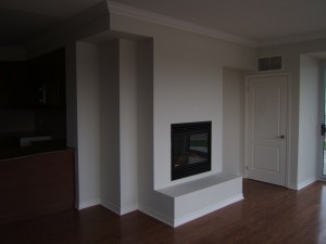 Plain drywall with fireplace before stone veneer added