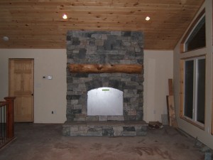 Granite veneer on fireplace with framing plate still attached.