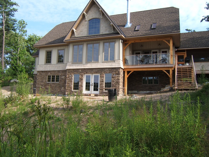 A cottage foundation with cultured stone application