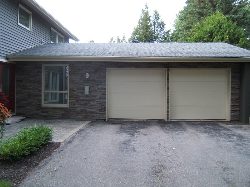 Garage view of home with Pro-Fit Alpine Cultured Stone Ledge Stone.