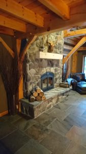 Stone veneer on wood burning fireplace.