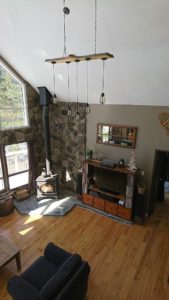 Stone veneer surround with granite hearth.