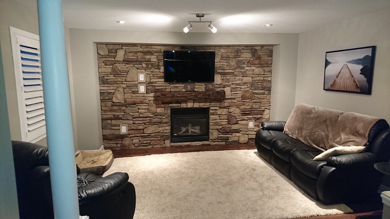 Living room stone veneer accent wall.