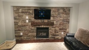 Living room wall with cultured stone veneer.