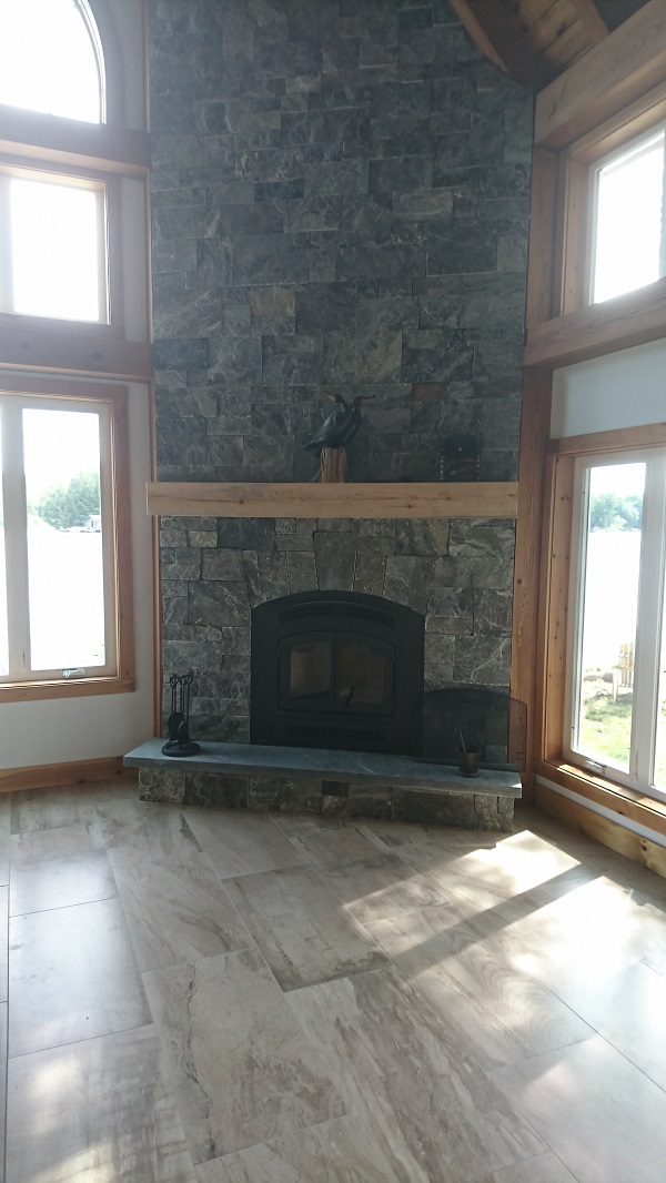 Granite veneer corner fireplace.