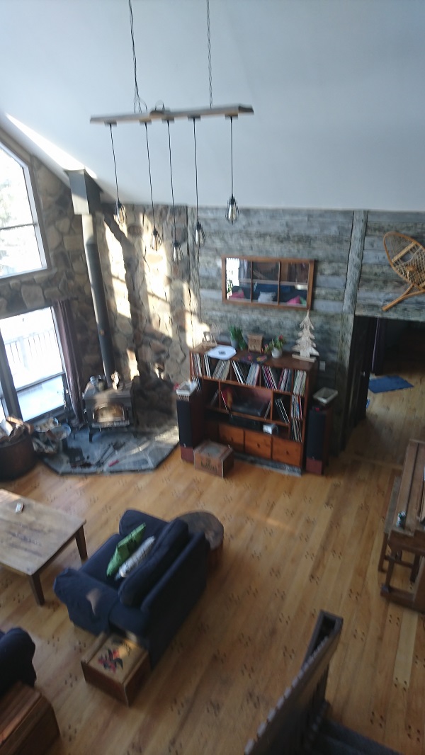 View of stone veneer and barn board on Living Room wall.