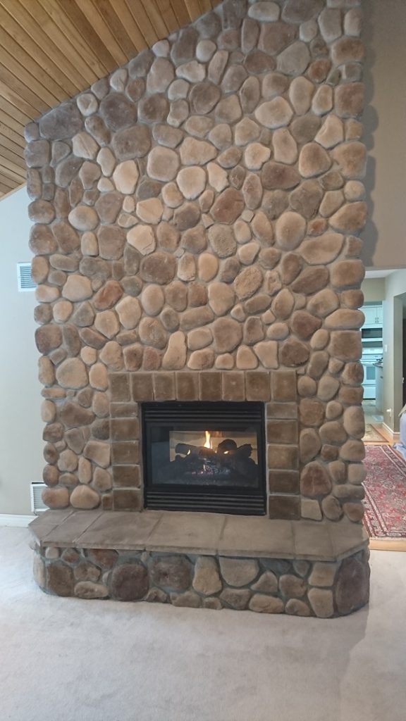 Stone Veneer Over a Brick Fireplace updates the look