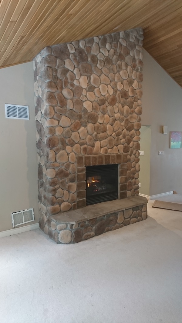 Fog coloured hearth and trim stones compliment the River Rock.