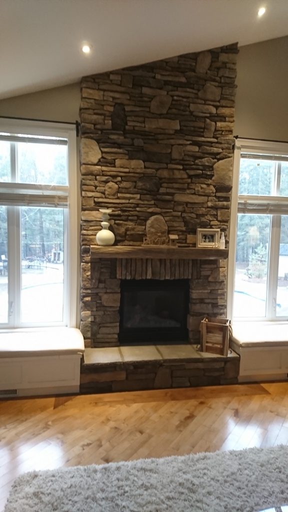 Dry stack stone veneer fireplace.