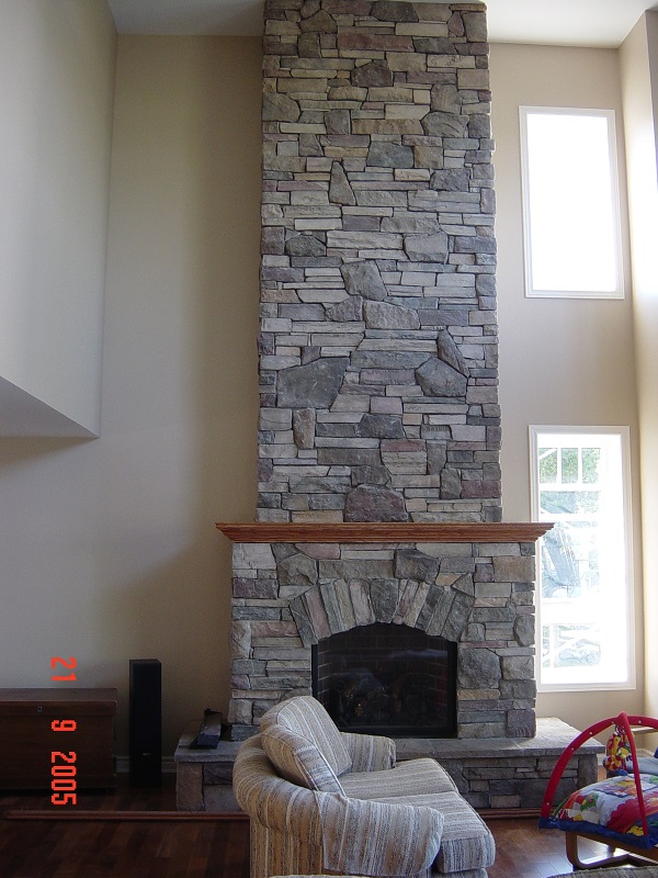 Blended stone veneer textures on an interior fireplace