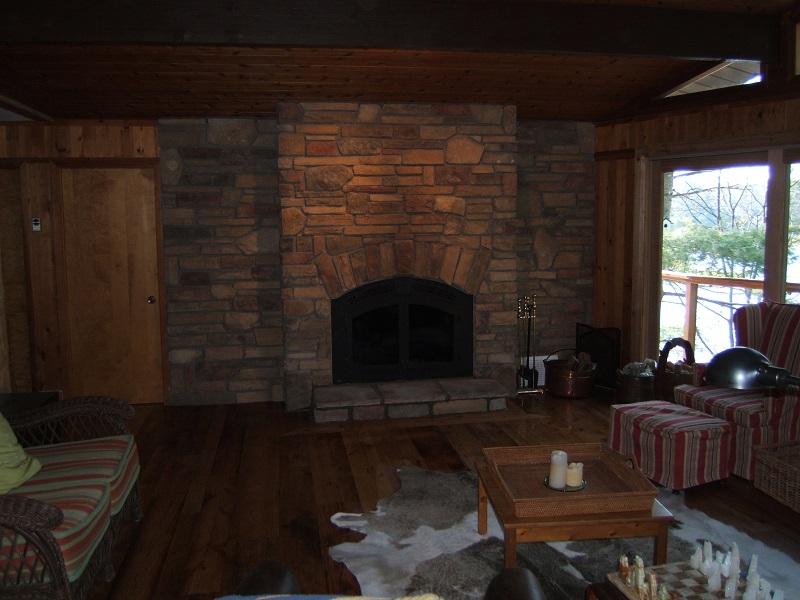 Fireplace and accent wall without a mantle.