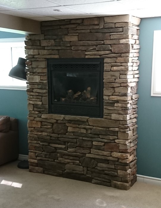 Dry stack stone on gas fireplace