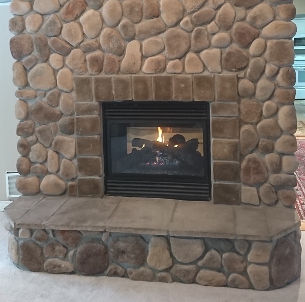 Brick fireplace with cultured stone makeover